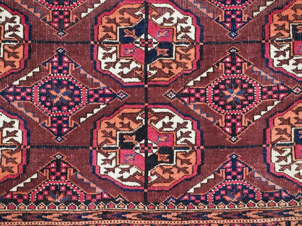 ANTIQUE TEKKE TURKMEN RUG, COCHINEAL DYE HIGHLIGHTS, CIRCA 1900. View X
