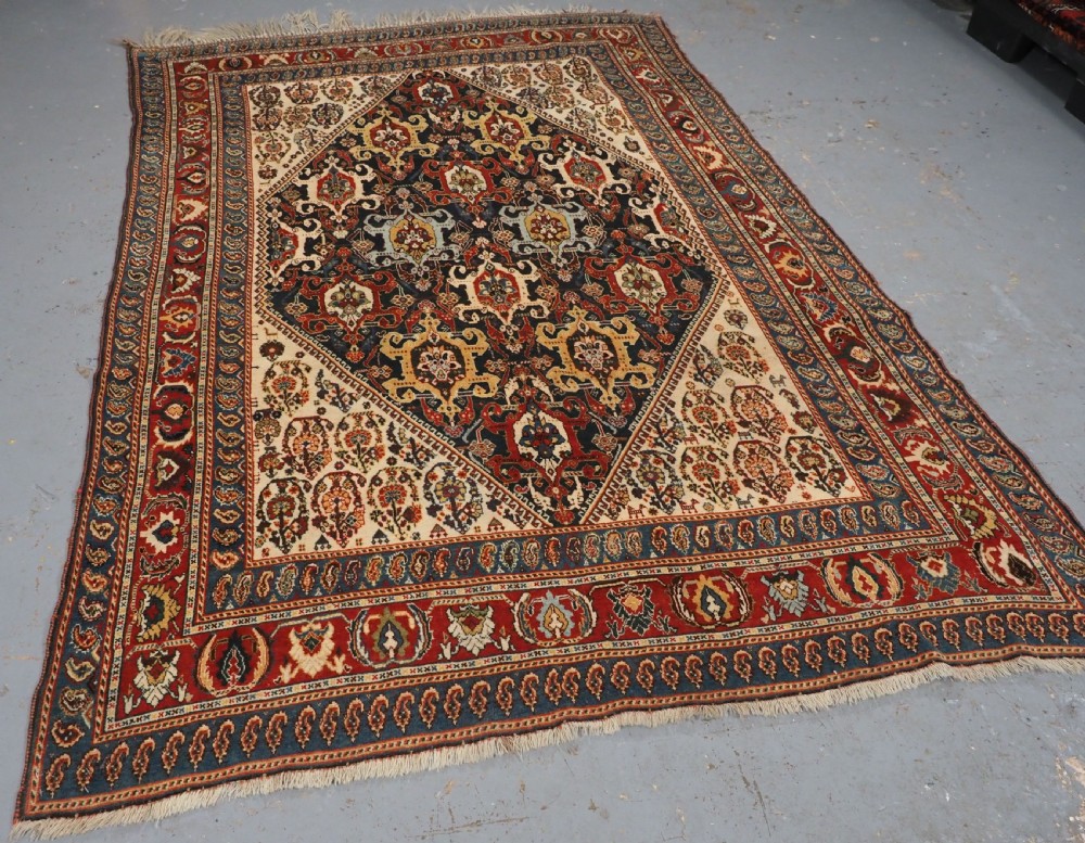 ANTIQUE QASHQAI KASHKULI RUG WITH REPEAT MEDALLION DESIGN, CIRCA 1900. View II