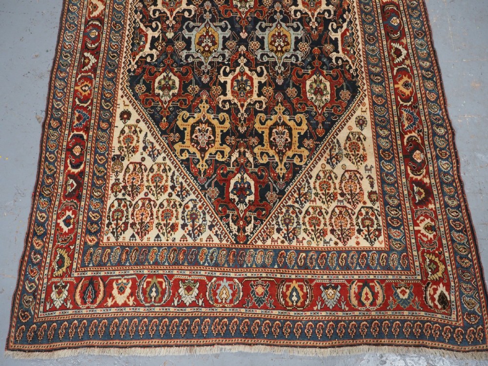 ANTIQUE QASHQAI KASHKULI RUG WITH REPEAT MEDALLION DESIGN, CIRCA 1900. View V