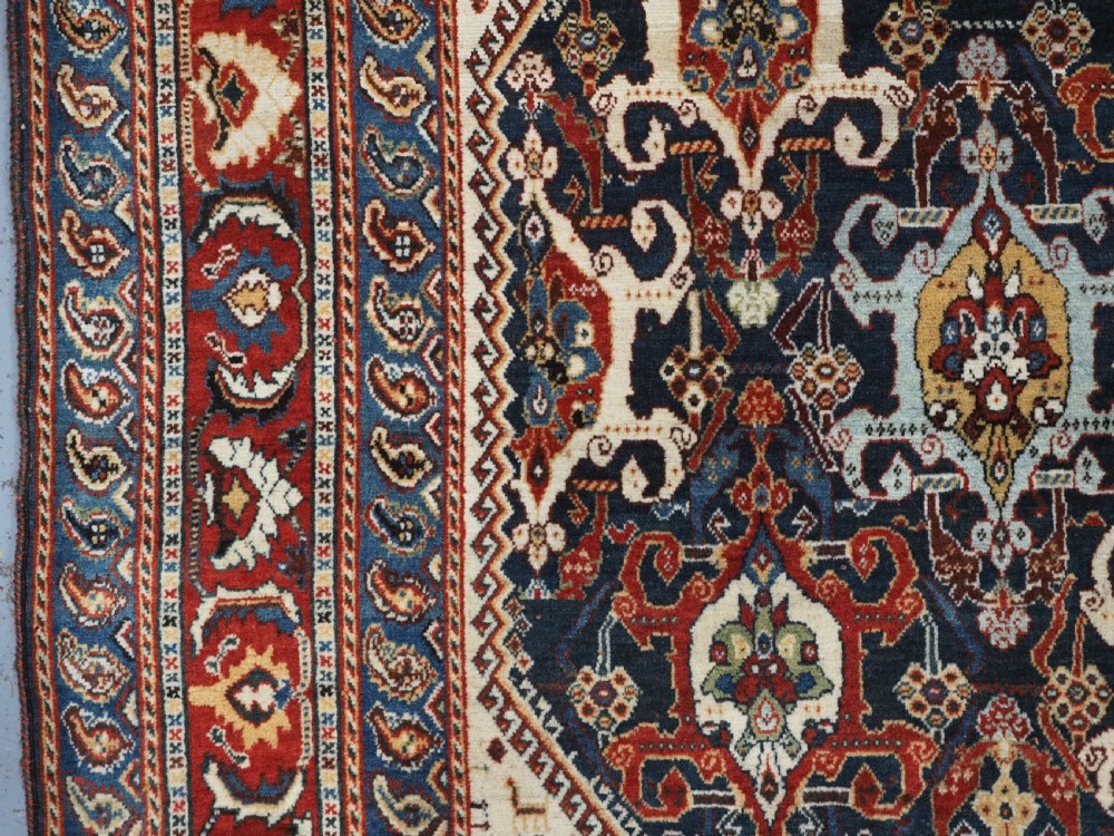 ANTIQUE QASHQAI KASHKULI RUG WITH REPEAT MEDALLION DESIGN, CIRCA 1900. View VII