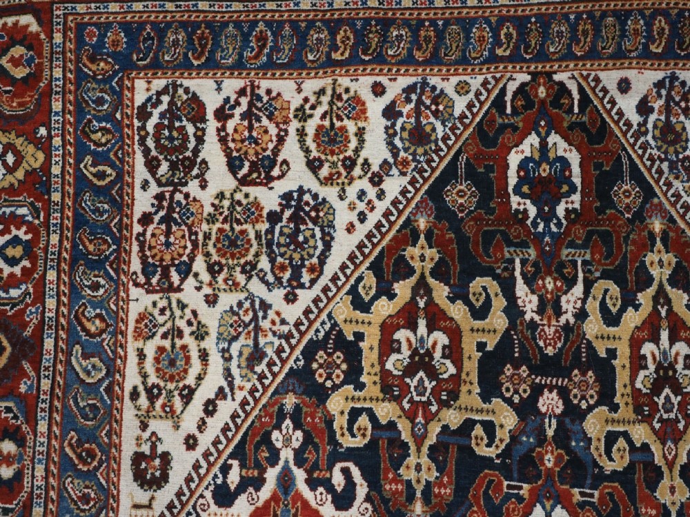 ANTIQUE QASHQAI KASHKULI RUG WITH REPEAT MEDALLION DESIGN, CIRCA 1900. View VIII