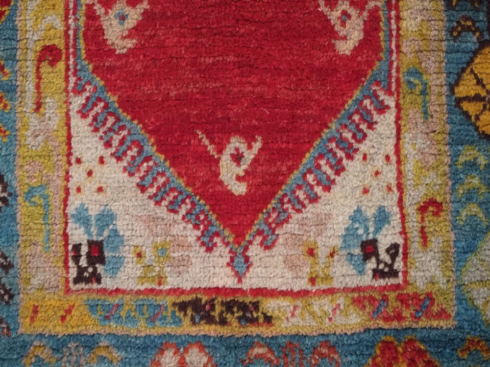 ANTIQUE TURKISH OUSHAK RUG, SMALL SIZE WITH SUPERB COLOUR, CIRCA 1900. View X