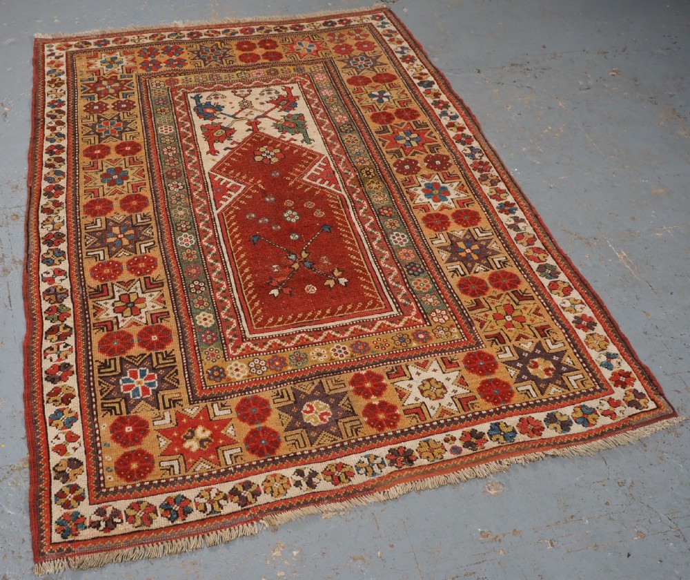 ANTIQUE TURKISH MILAS PRAYER RUG, STAR & ROSETTE BORDER, CIRCA 1800-1825. View II