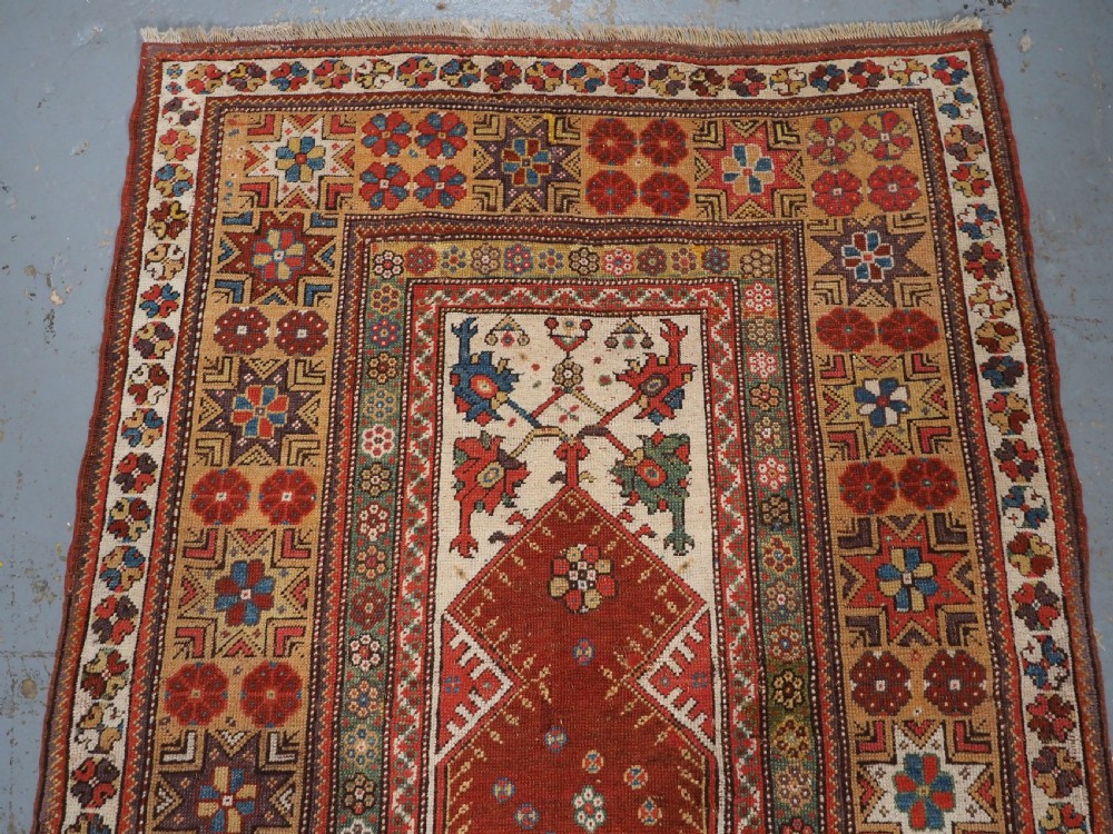 ANTIQUE TURKISH MILAS PRAYER RUG, STAR & ROSETTE BORDER, CIRCA 1800-1825. View III