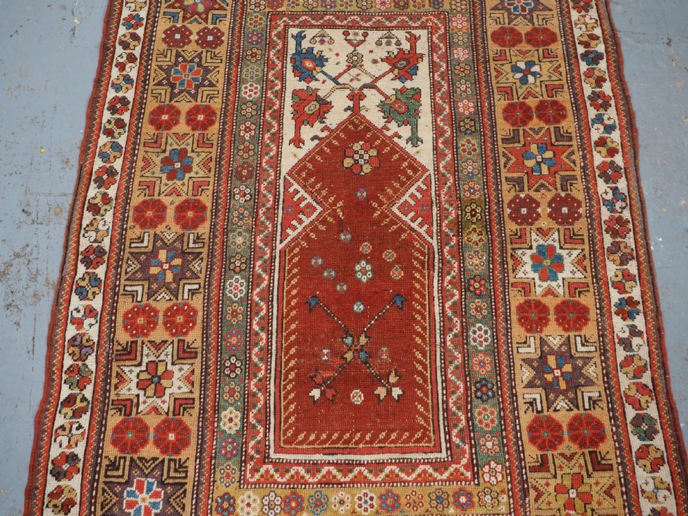 ANTIQUE TURKISH MILAS PRAYER RUG, STAR & ROSETTE BORDER, CIRCA 1800-1825. View IV