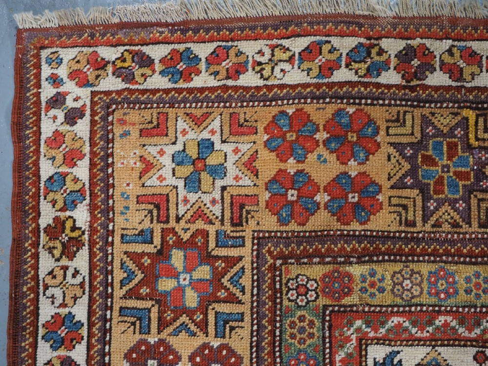 ANTIQUE TURKISH MILAS PRAYER RUG, STAR & ROSETTE BORDER, CIRCA 1800-1825. View VI