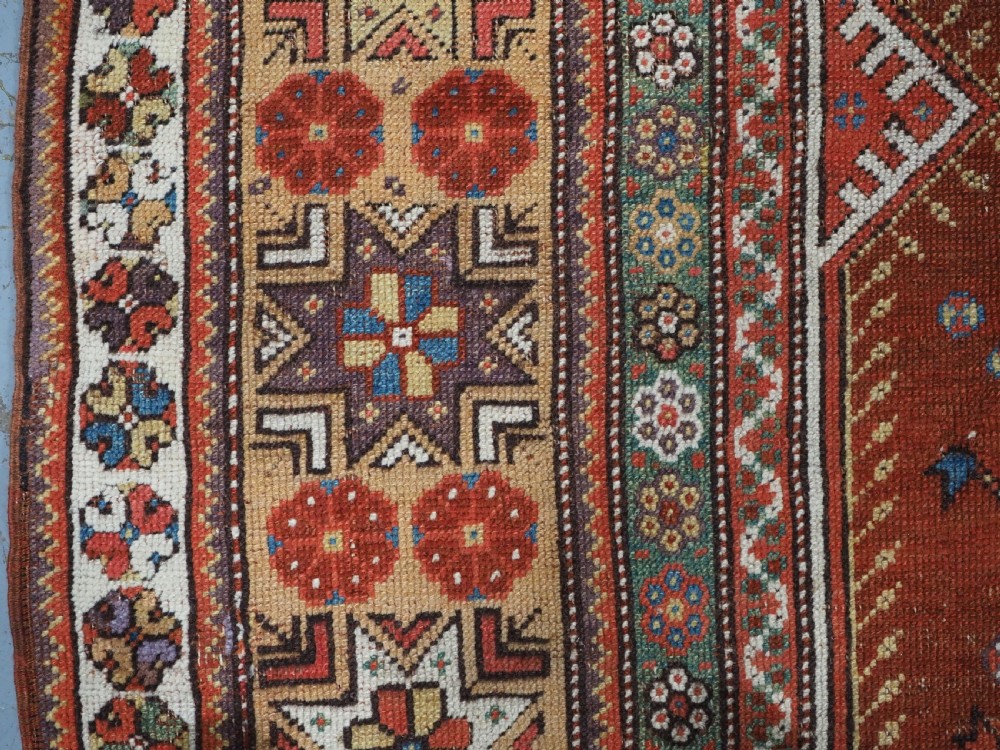 ANTIQUE TURKISH MILAS PRAYER RUG, STAR & ROSETTE BORDER, CIRCA 1800-1825. View VII
