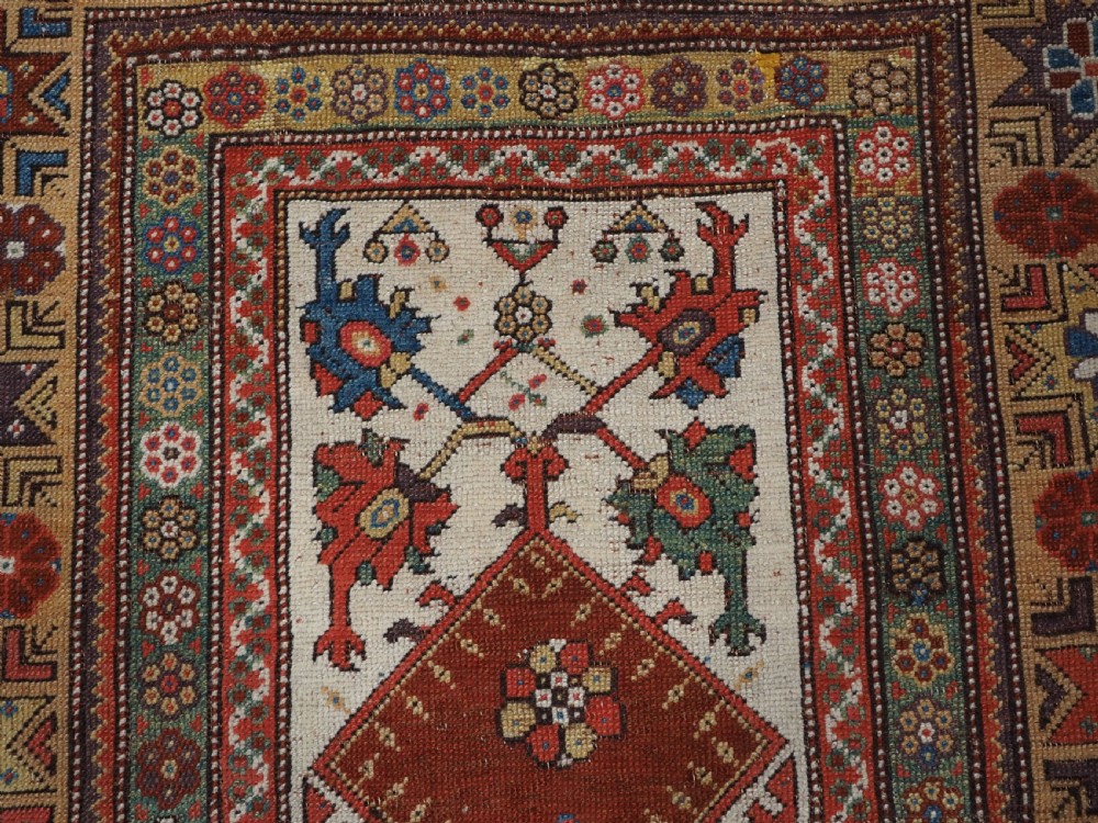 ANTIQUE TURKISH MILAS PRAYER RUG, STAR & ROSETTE BORDER, CIRCA 1800-1825. View VIII