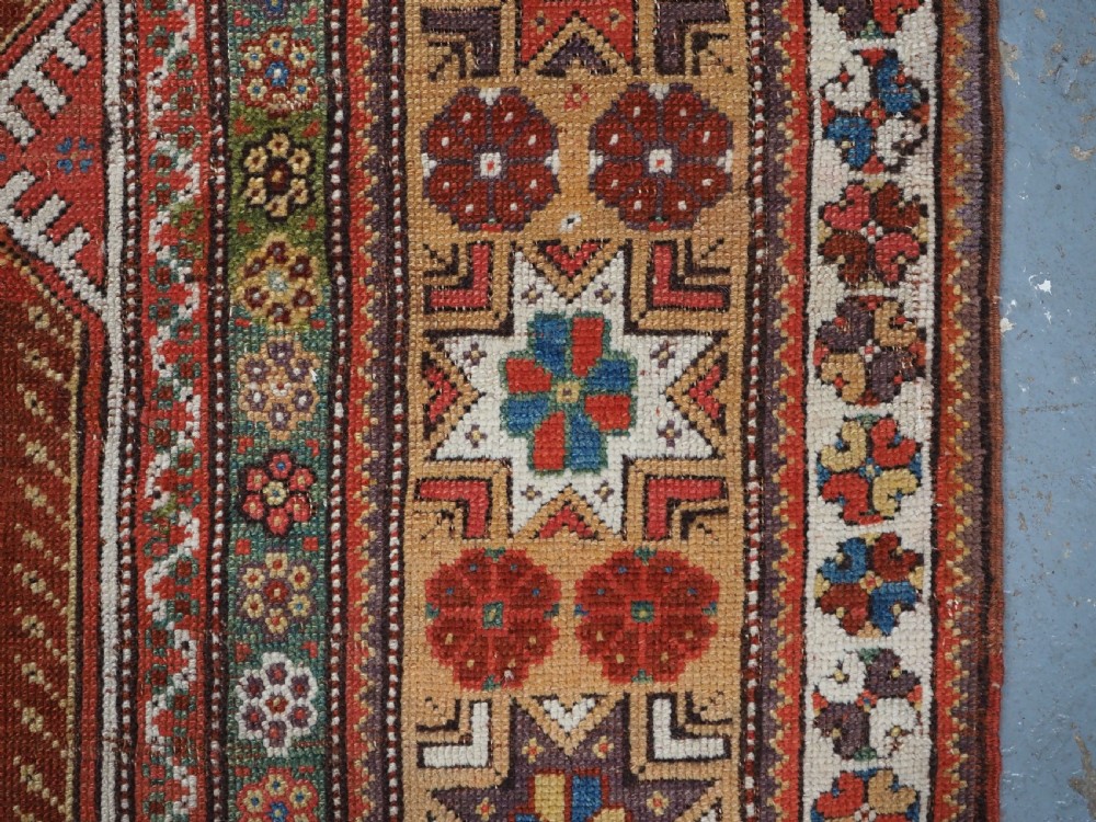 ANTIQUE TURKISH MILAS PRAYER RUG, STAR & ROSETTE BORDER, CIRCA 1800-1825. View XI