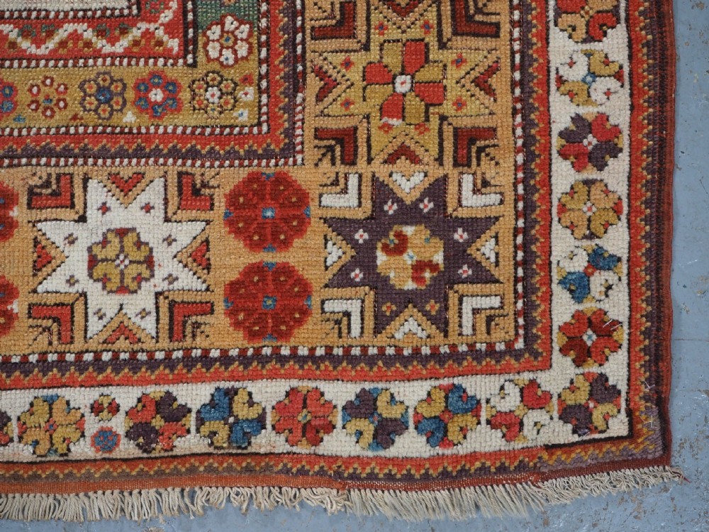 ANTIQUE TURKISH MILAS PRAYER RUG, STAR & ROSETTE BORDER, CIRCA 1800-1825. View XII
