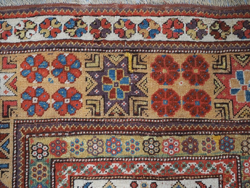 ANTIQUE TURKISH MILAS PRAYER RUG, STAR & ROSETTE BORDER, CIRCA 1800-1825. View XIV