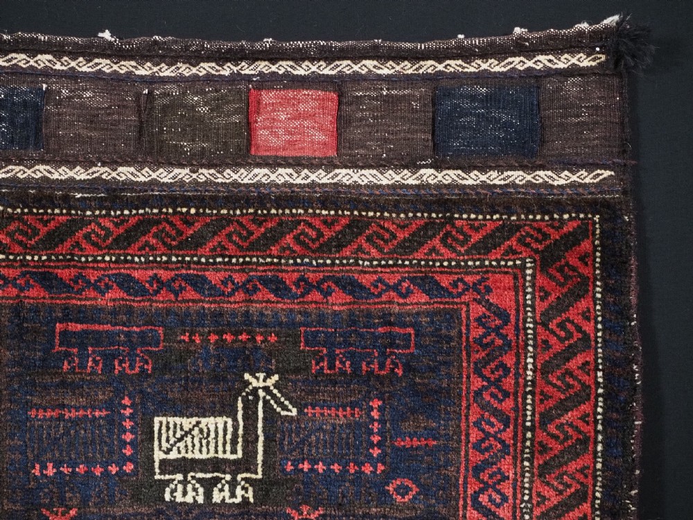 ANTIQUE BALUCH SADDLEBAG FACE WITH BIRD / COCKEREL DESIGN, CIRCA 1900. View III