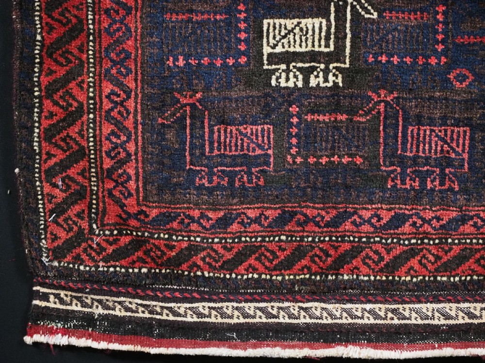 ANTIQUE BALUCH SADDLEBAG FACE WITH BIRD / COCKEREL DESIGN, CIRCA 1900. View IV