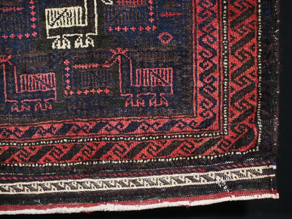 ANTIQUE BALUCH SADDLEBAG FACE WITH BIRD / COCKEREL DESIGN, CIRCA 1900. View V