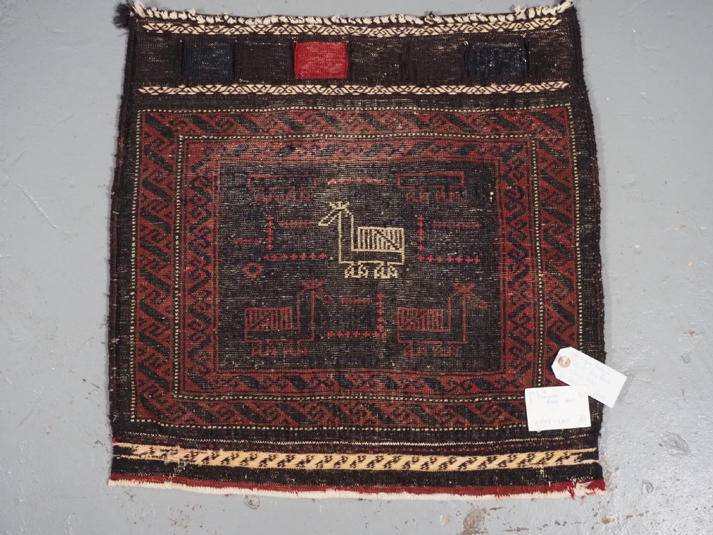 ANTIQUE BALUCH SADDLEBAG FACE WITH BIRD / COCKEREL DESIGN, CIRCA 1900. View VIII