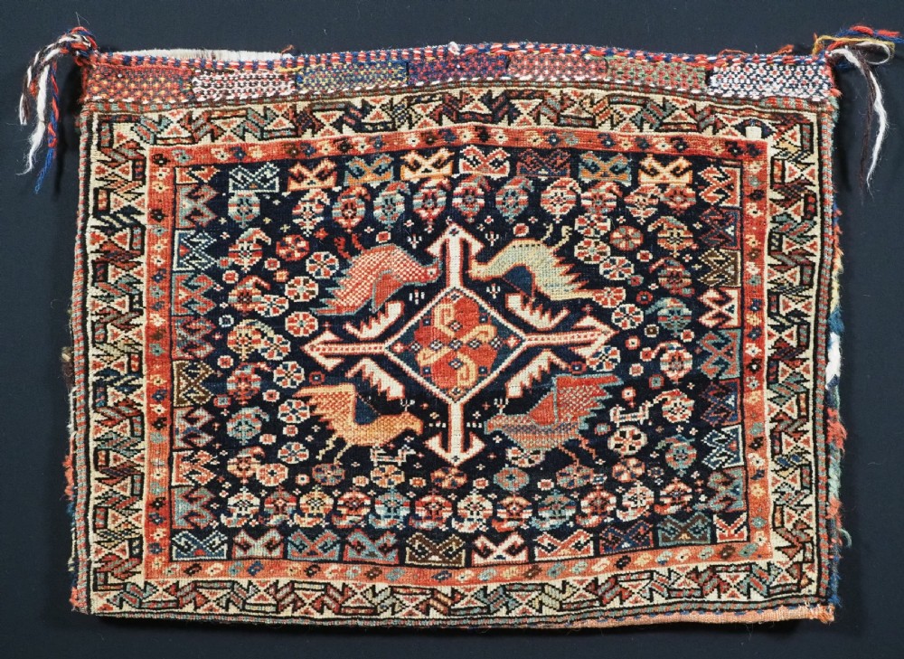 ANTIQUE KHAMSEH TRIBAL SADDLEBAG WITH SOUGHT AFTER BIRD DESIGN, CIRCA 1880.
