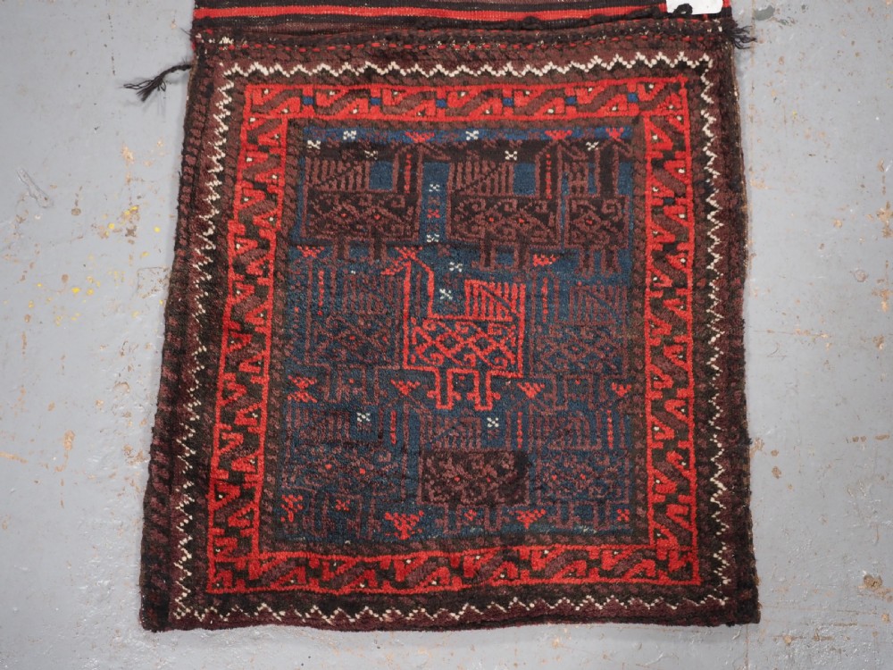 ANTIQUE PAIR OF BALUCH SADDLEBAGS WITH BIRD DESIGN, CIRCA 1900/20. View II