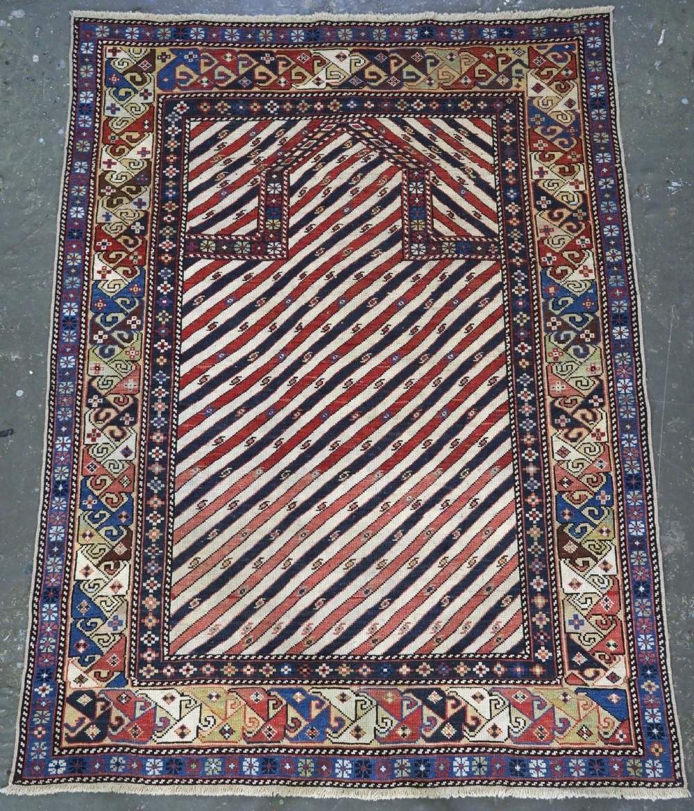 ANTIQUE CAUCASIAN SHIRVAN OR DAGESTAN PRAYER RUG OF SCARCE DIAGONAL STRIPE DESIGN, CIRCA 1850.