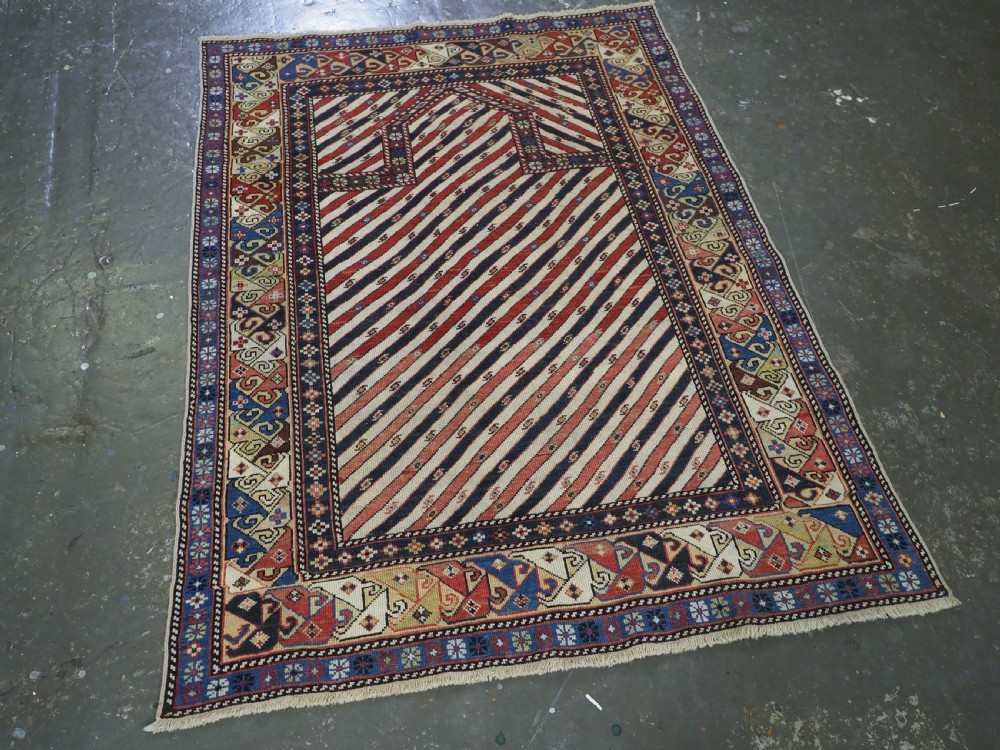 ANTIQUE CAUCASIAN SHIRVAN OR DAGESTAN PRAYER RUG OF SCARCE DIAGONAL STRIPE DESIGN, CIRCA 1850. View II