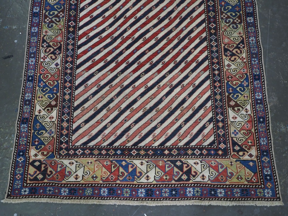 ANTIQUE CAUCASIAN SHIRVAN OR DAGESTAN PRAYER RUG OF SCARCE DIAGONAL STRIPE DESIGN, CIRCA 1850. View IV