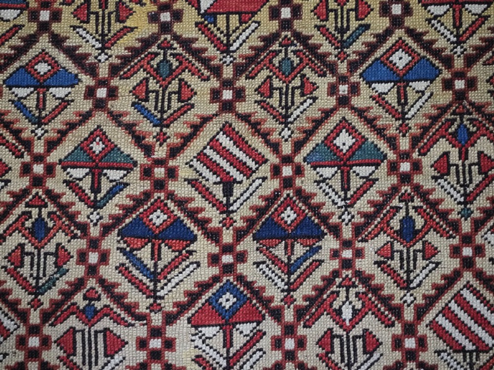 A hand-knotted Caucasian Marasali prayer rug featuring a yellow ground with a prominent pointed mihrab arch, diamond lattice patterns, and geometric borders in red, blue, and brown. View VI