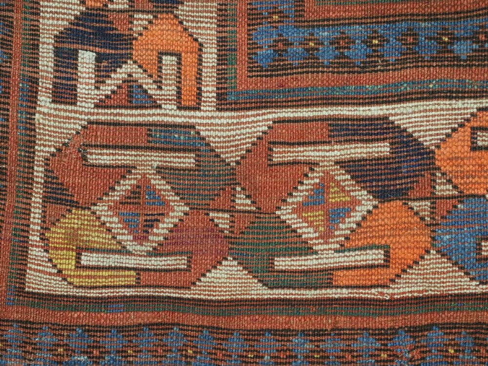 An antique Caucasian Moghan Kazak hand-knotted wool runner rug featuring a repeating geometric Memling gul pattern in navy, terracotta, ochre, and cream. View XIII