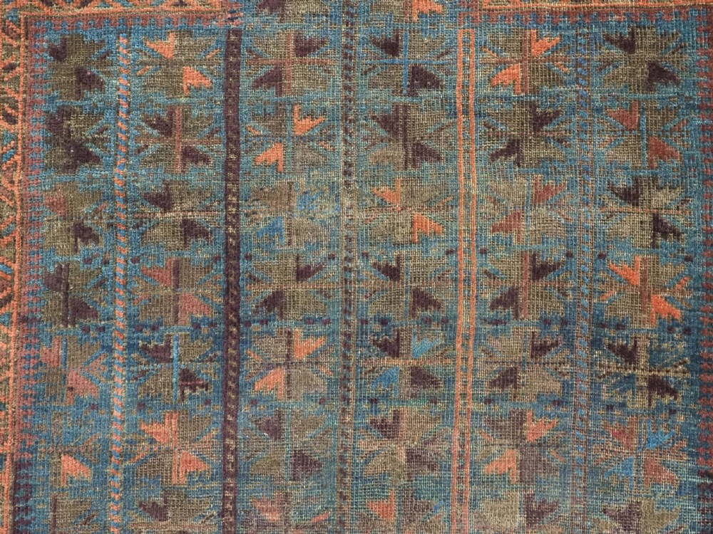 ANTIQUE BALUCH OR TIMURI BLUE GROUND PRAYER RUG, CIRCA 1880. View IX