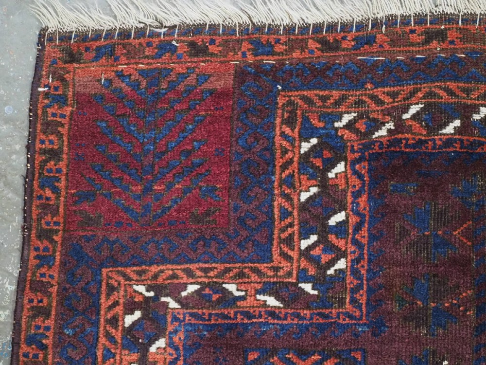 An antique hand-knotted wool prayer rug featuring a defined mihrab arch, geometric box patterns, and deep aubergine, rust red, and indigo blue tones. View VIII