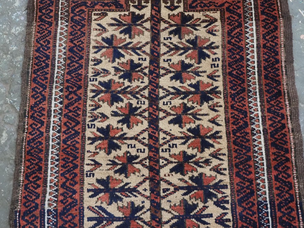 An antique hand-knotted Baluch prayer rug featuring a camel-coloured ground, central tree of life motif, mihrab arch, and decorative geometric borders. View IV