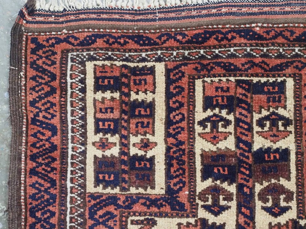 An antique hand-knotted Baluch prayer rug featuring a camel-coloured ground, central tree of life motif, mihrab arch, and decorative geometric borders. View VI