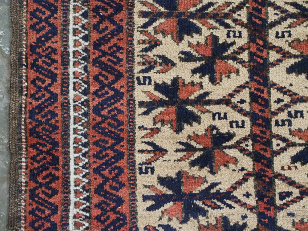 An antique hand-knotted Baluch prayer rug featuring a camel-coloured ground, central tree of life motif, mihrab arch, and decorative geometric borders. View VII