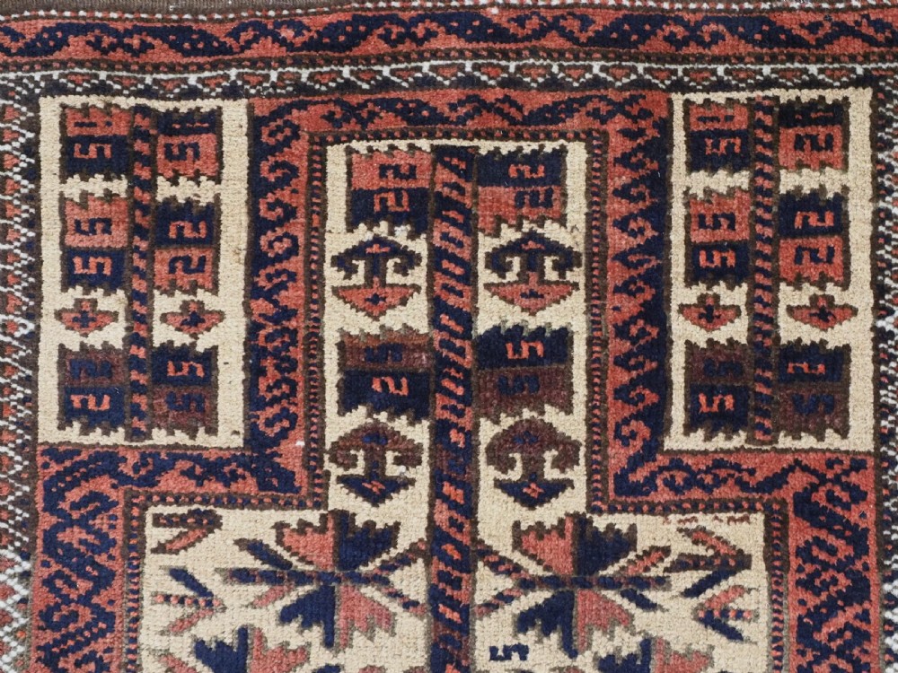 An antique hand-knotted Baluch prayer rug featuring a camel-coloured ground, central tree of life motif, mihrab arch, and decorative geometric borders. View VIII