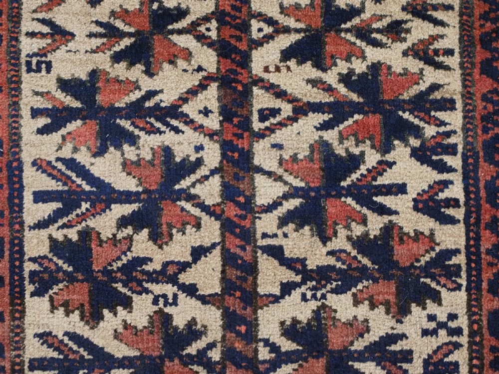 An antique hand-knotted Baluch prayer rug featuring a camel-coloured ground, central tree of life motif, mihrab arch, and decorative geometric borders. View IX