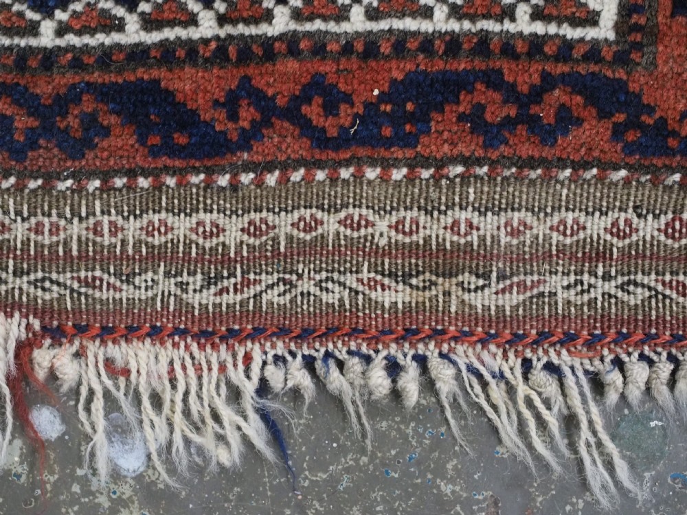An antique hand-knotted Baluch prayer rug featuring a camel-coloured ground, central tree of life motif, mihrab arch, and decorative geometric borders. View XI
