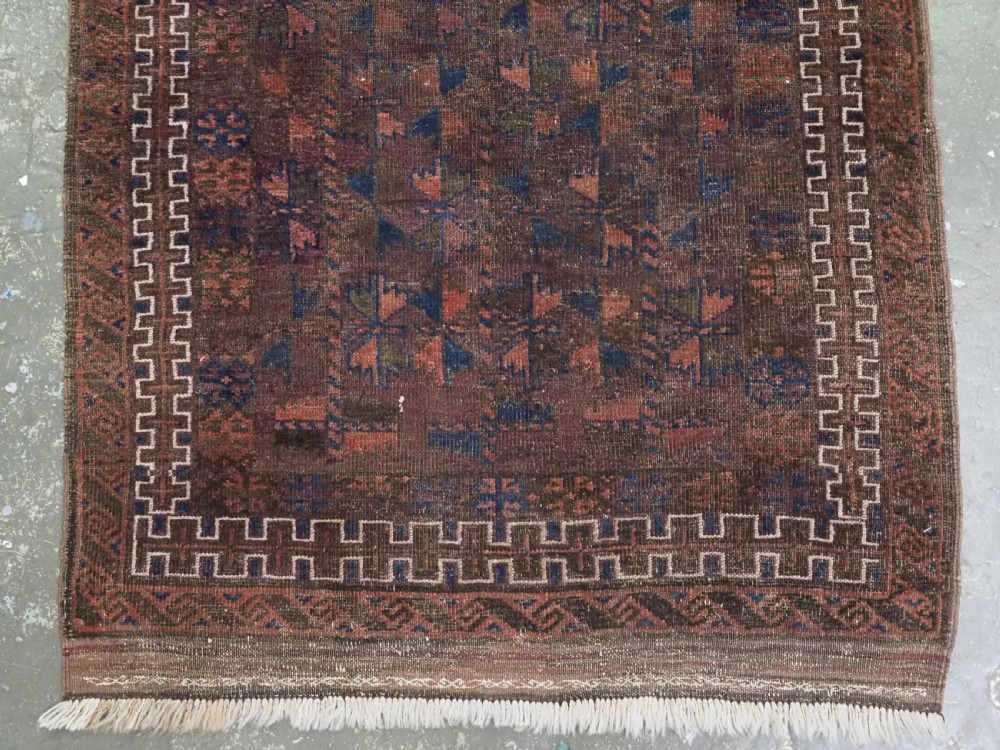 ANTIQUE BALUCH PRAYER RUG, WESTERN AFGHANISTAN, REPEAT LEAF DESIGN, CIRCA 1900. View IV