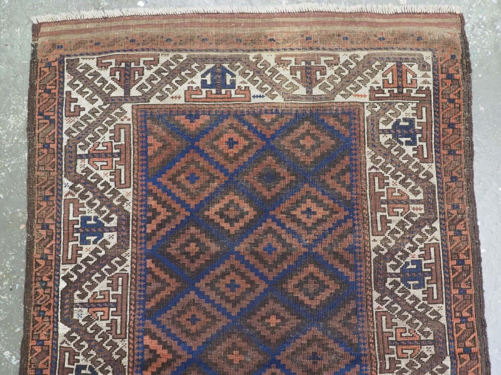 ANTIQUE TIMURI OR BALUCH RUG, LARGE IVORY BORDER, CIRCA 1880. View III