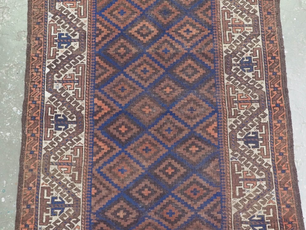 ANTIQUE TIMURI OR BALUCH RUG, LARGE IVORY BORDER, CIRCA 1880. View IV