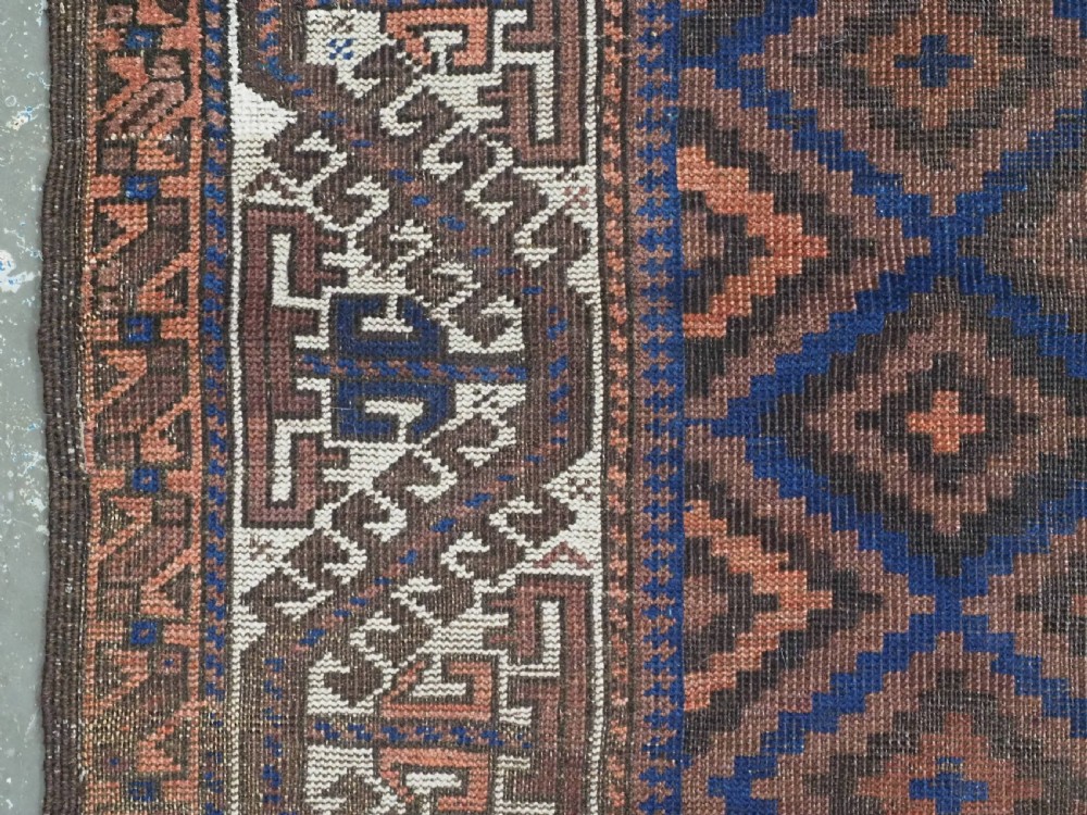 ANTIQUE TIMURI OR BALUCH RUG, LARGE IVORY BORDER, CIRCA 1880. View VII