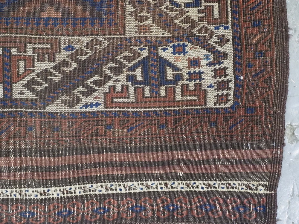 ANTIQUE TIMURI OR BALUCH RUG, LARGE IVORY BORDER, CIRCA 1880. View IX