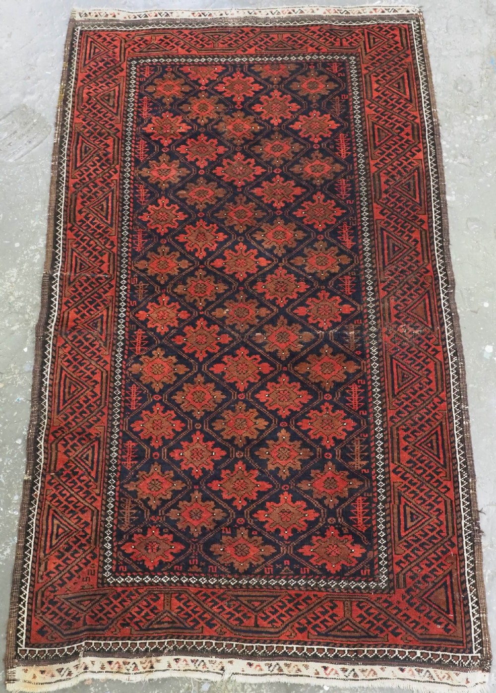 ANTIQUE RUG BY THE BALUCH TRIBES OF KHORASAN PROVIENCE, CIRCA 1880.