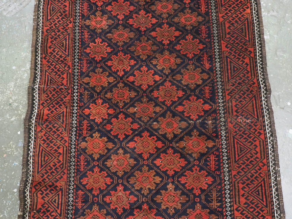 ANTIQUE RUG BY THE BALUCH TRIBES OF KHORASAN PROVIENCE, CIRCA 1880. View IV