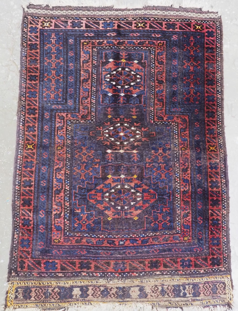 ANTIQUE PRAYER RUG BY THE TIMURI OF WESTERN AFGHANISTAN, BLUE GROUND, CIRCA 1880.