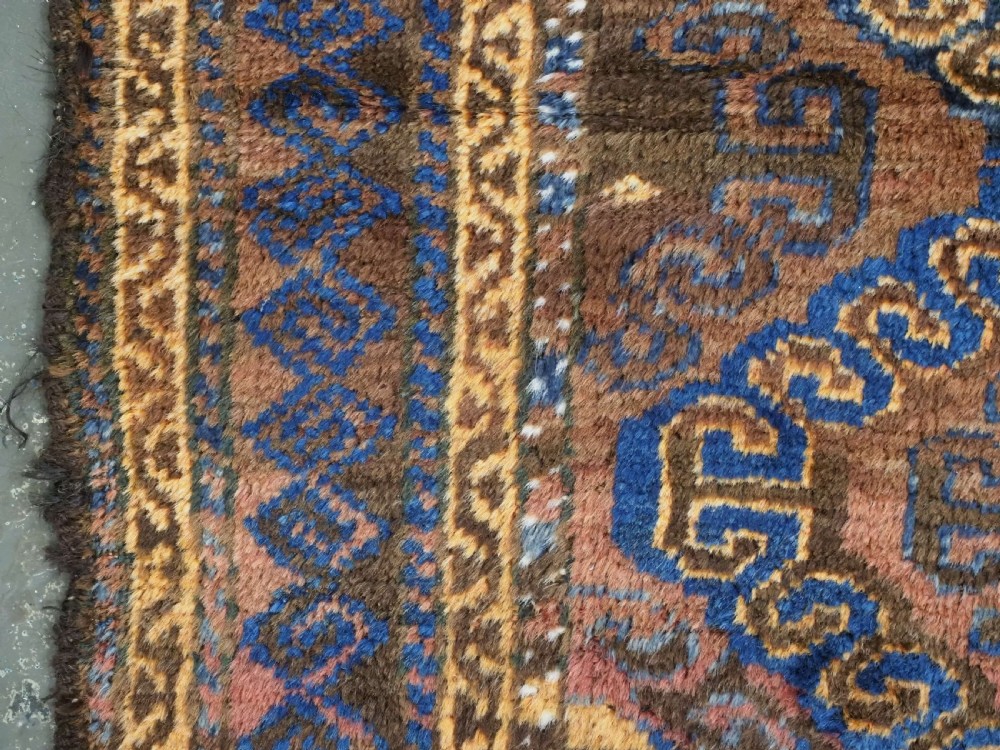 ANTIQUE AFGHAN PRAYER RUG BY THE TAIMANI CHAHAR AIMAQ NOMADS, CIRCA 1900/20. View VI