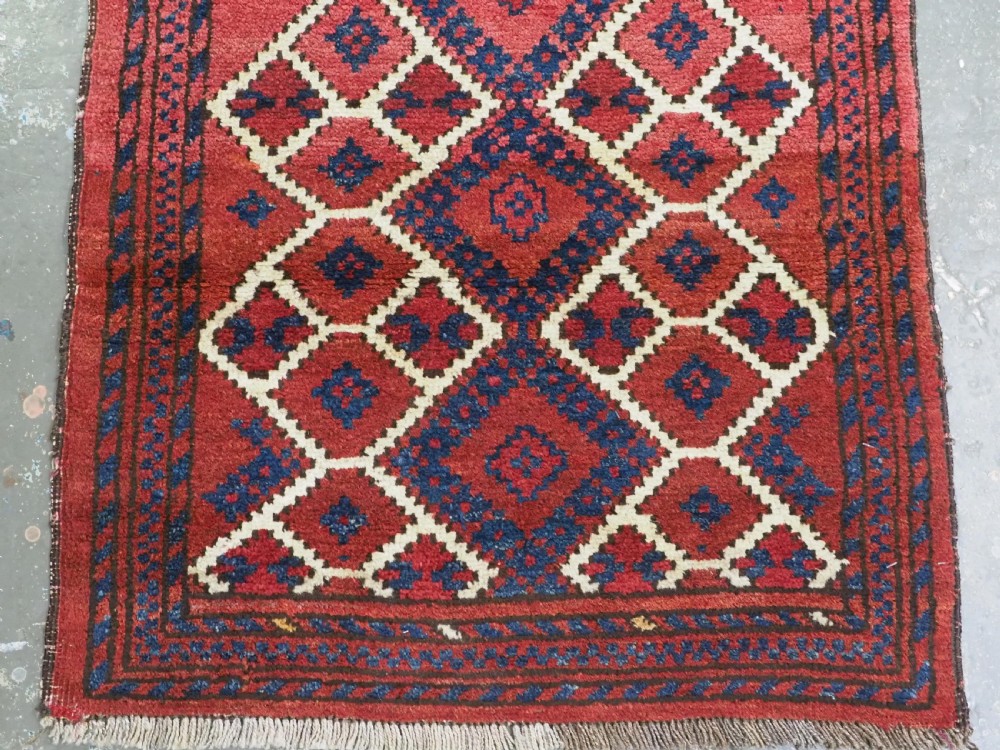 ANTIQUE AFGHAN VILLAGE RUG, SUPERB COLOUR AND DESIGN, CIRCA 1920.  View V