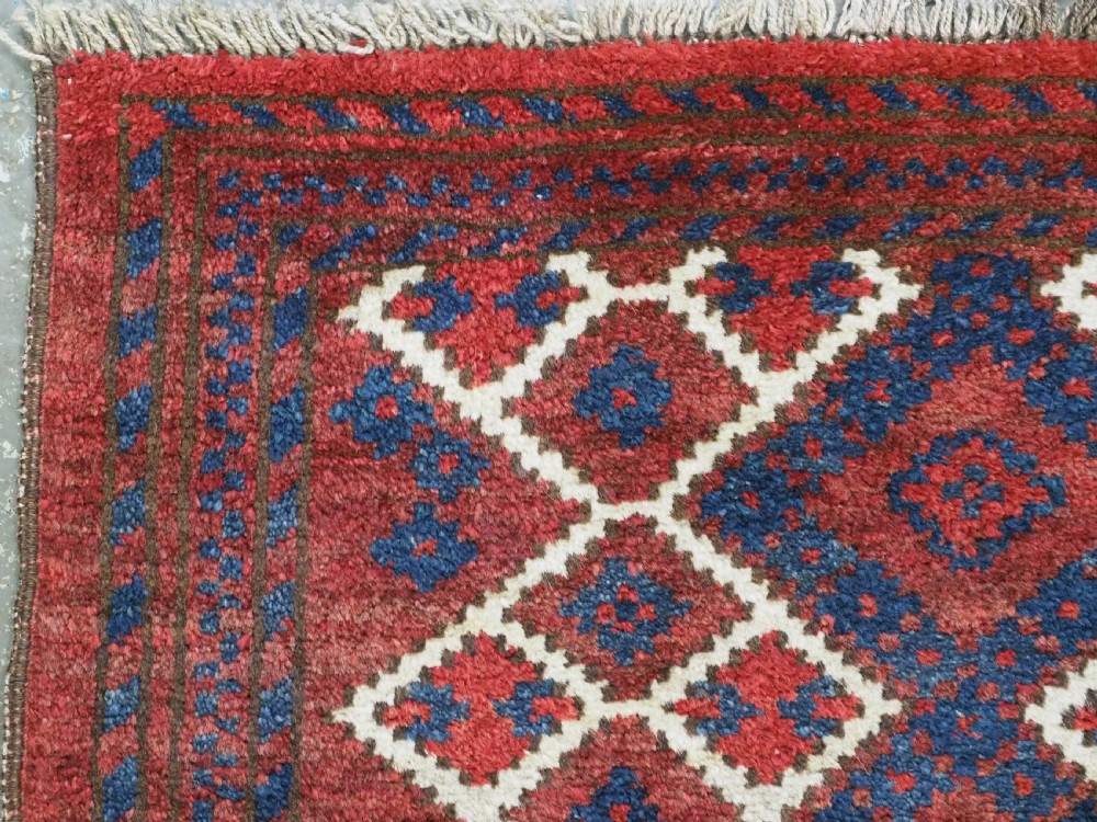 ANTIQUE AFGHAN VILLAGE RUG, SUPERB COLOUR AND DESIGN, CIRCA 1920.  View VI