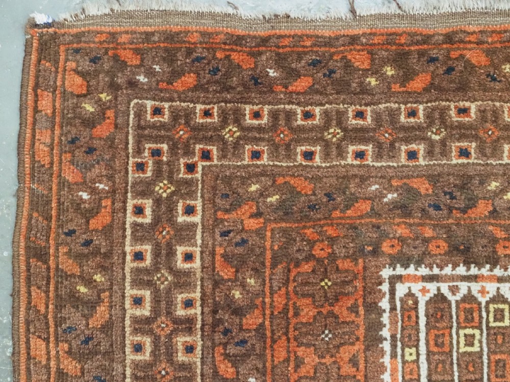 An antique Afghan Kizil Ayak hand-knotted wool rug featuring two opposing mosque niche designs in terracotta, brown, and ivory tones. View VII
