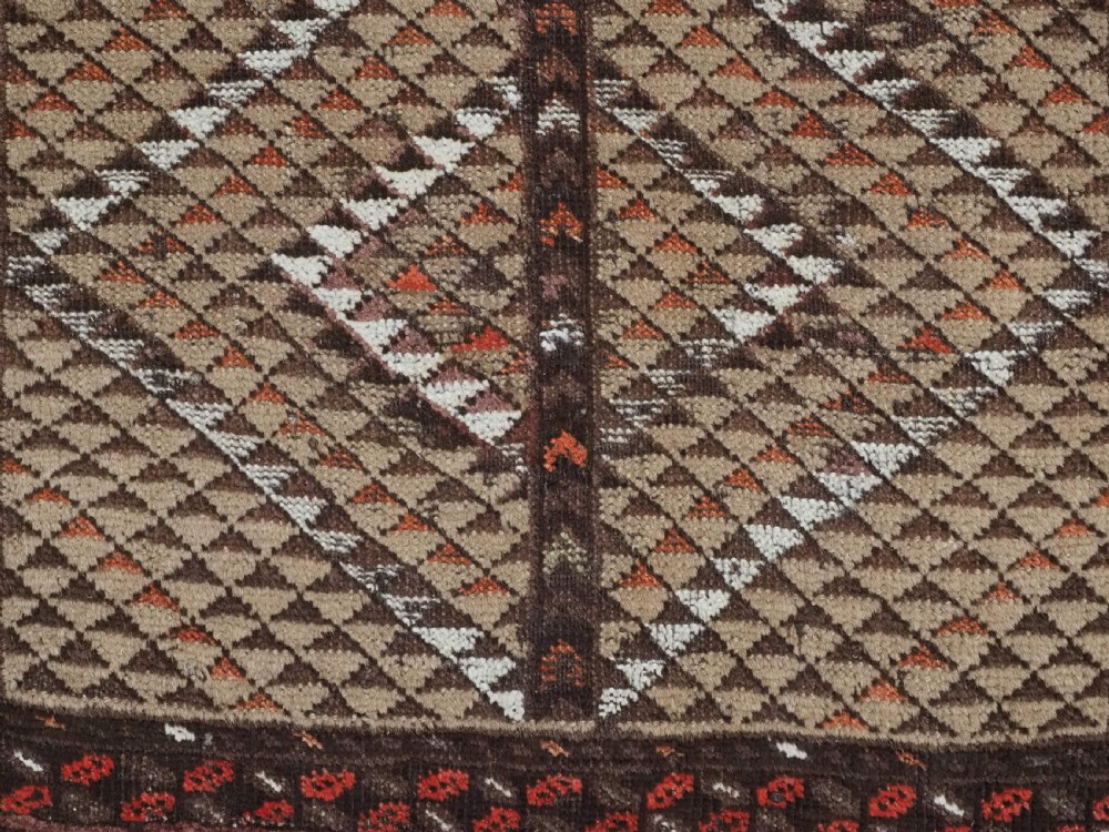 An antique hand-knotted Turkmen wool prayer rug featuring a dark brown and terracotta diamond lattice pattern with a prayer arch at the top. View X