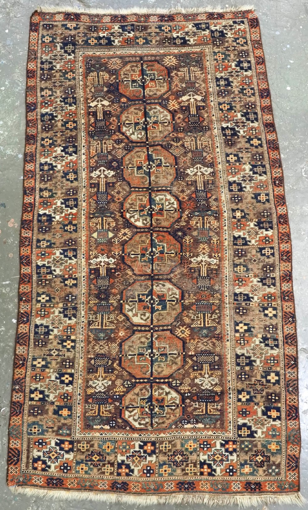 ANTIQUE MAHDAD KHANI BALUCH RUG OF INTERESTING TURKMEN GUL DESIGN, CIRCA 1880.