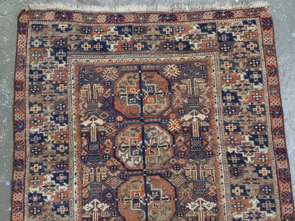 ANTIQUE MAHDAD KHANI BALUCH RUG OF INTERESTING TURKMEN GUL DESIGN, CIRCA 1880. View III