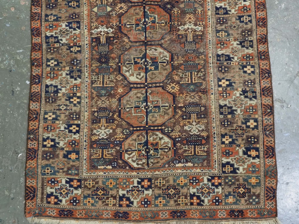 ANTIQUE MAHDAD KHANI BALUCH RUG OF INTERESTING TURKMEN GUL DESIGN, CIRCA 1880. View V